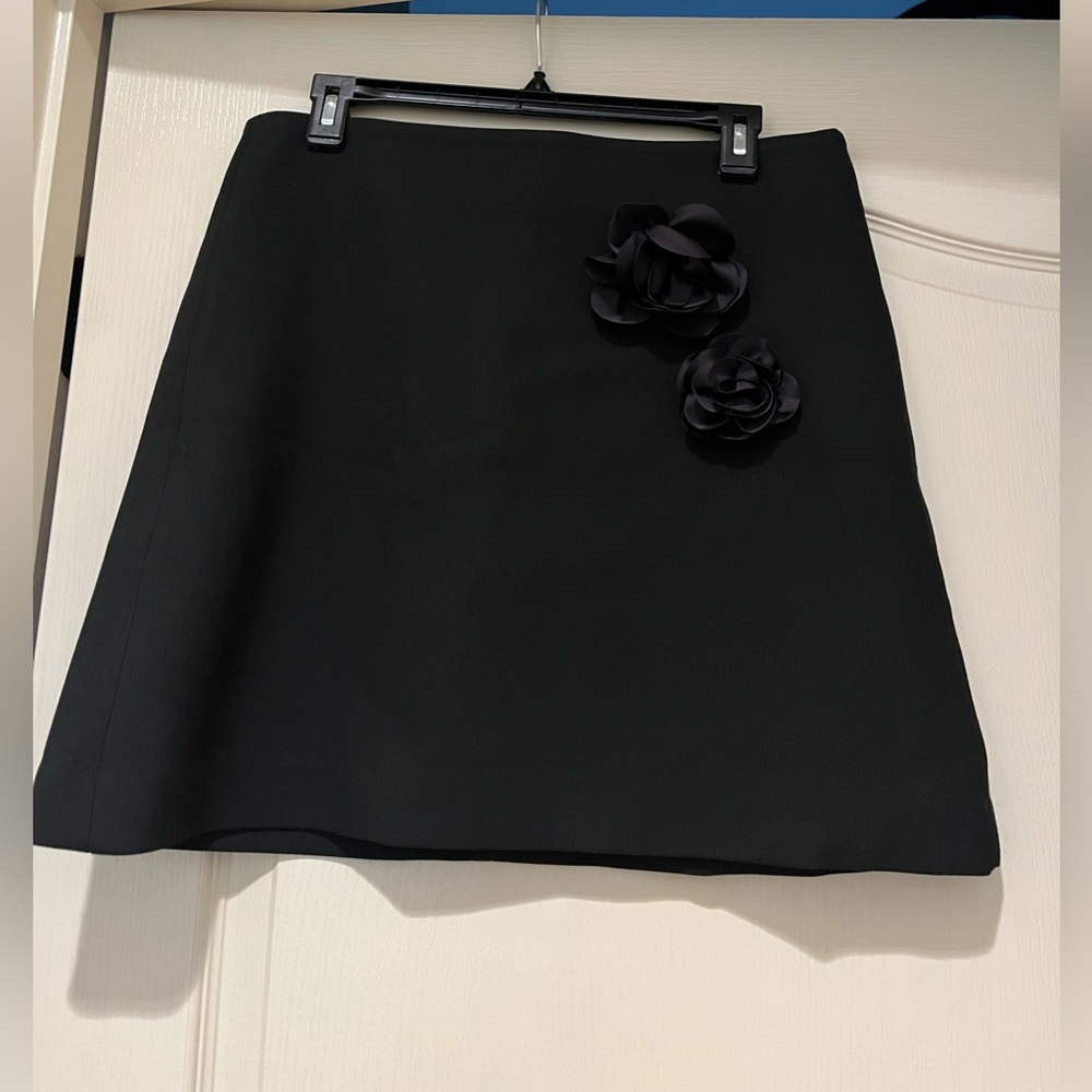 Anthropologie Little Black Mini Skirt with flower embellishments. New with Tags